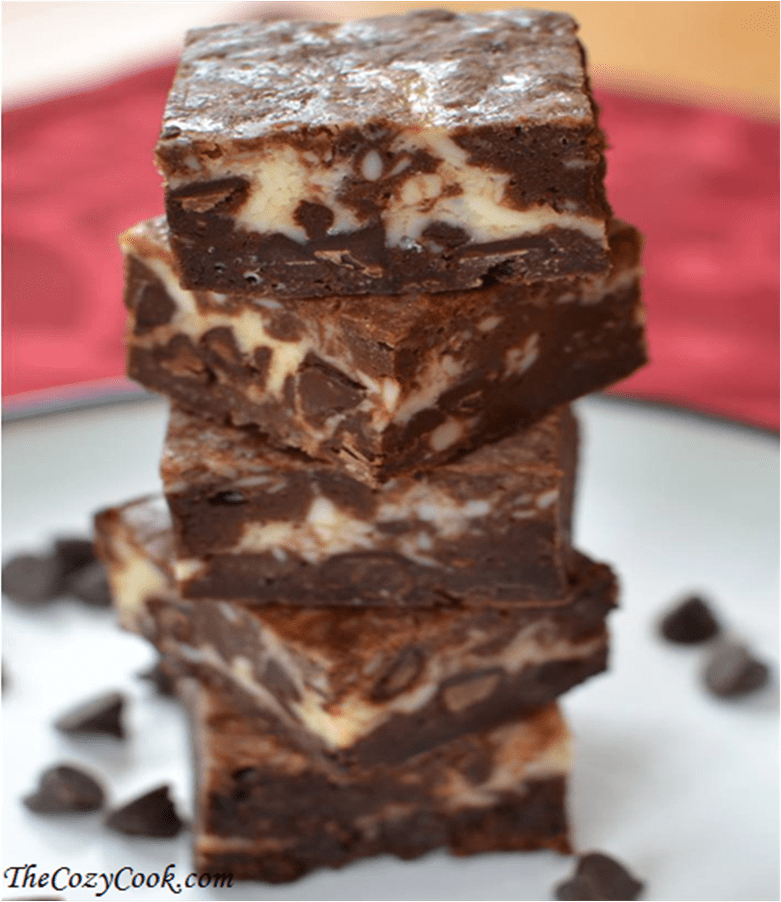 A stack of chocolate chip cheesecake brownies on a plate.
