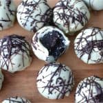 Oreo Truffles on a wooden surface.