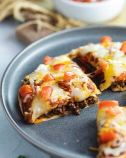 Taco Bell Mexican Pizza on a blue plate.