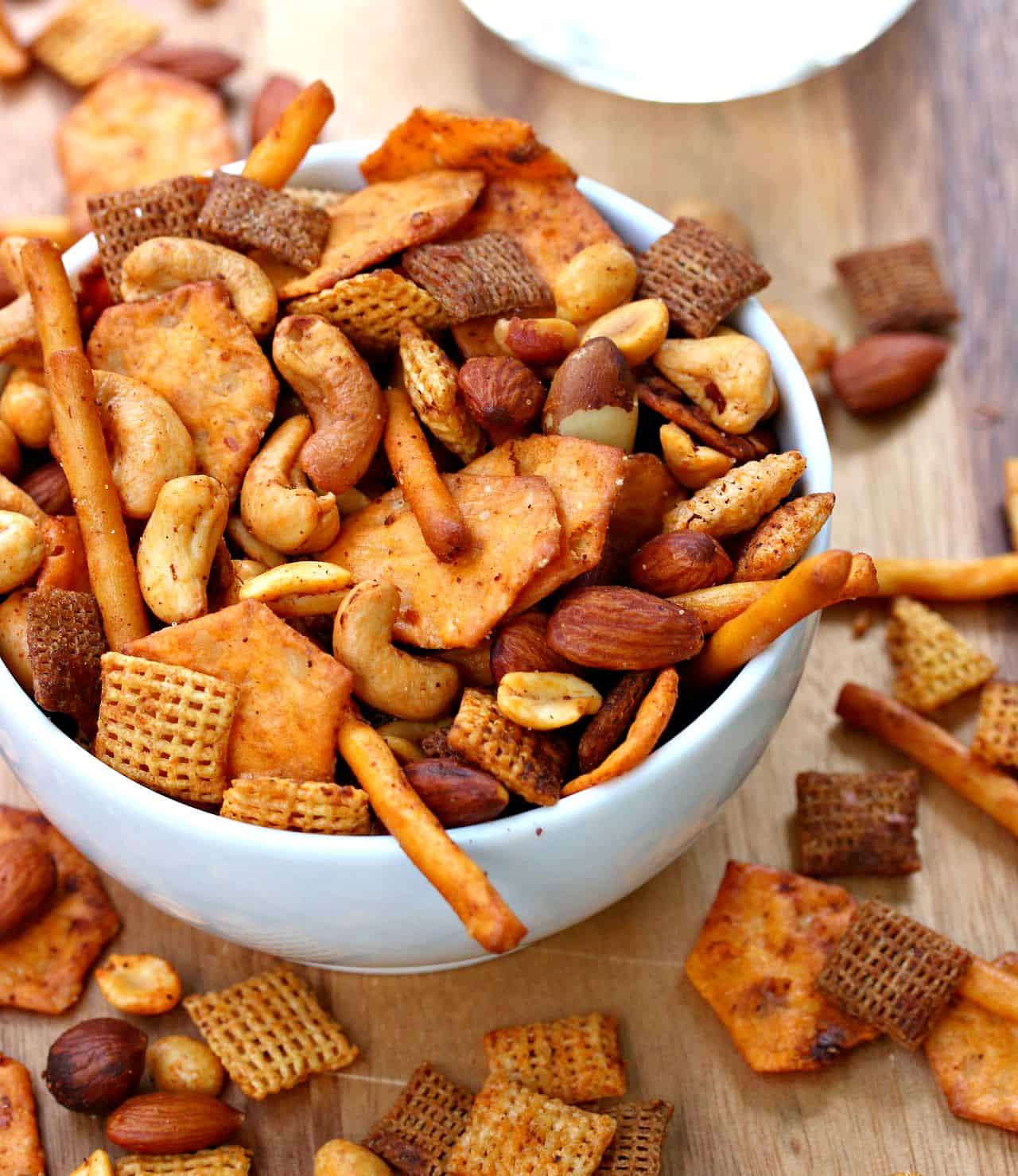 white bowl overflowing with chex mix