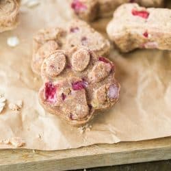 A dog treat paw print on a brown paper bag.