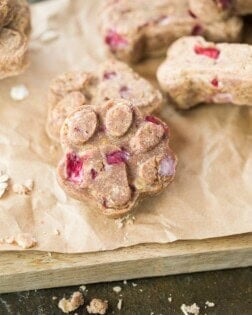 A dog treat paw print on a brown paper bag.