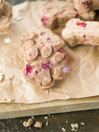 A dog treat paw print on a brown paper bag.