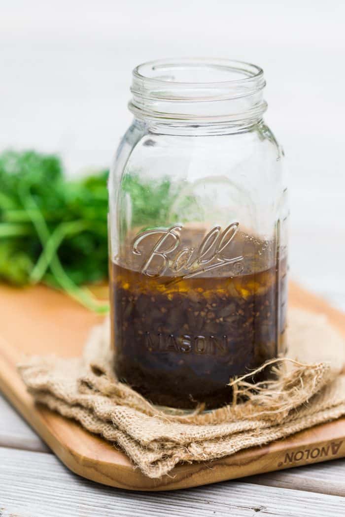 Mason jar filled with chicken marinade.