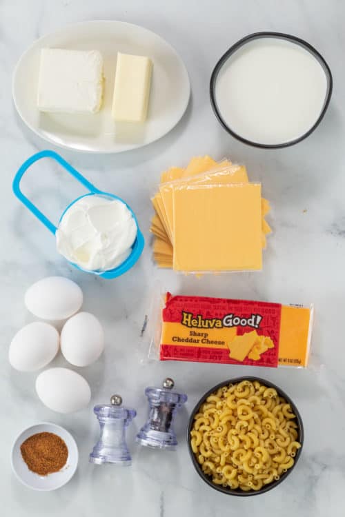 Ingredients to make Paula Deen's Mac and Cheese on a white Surface