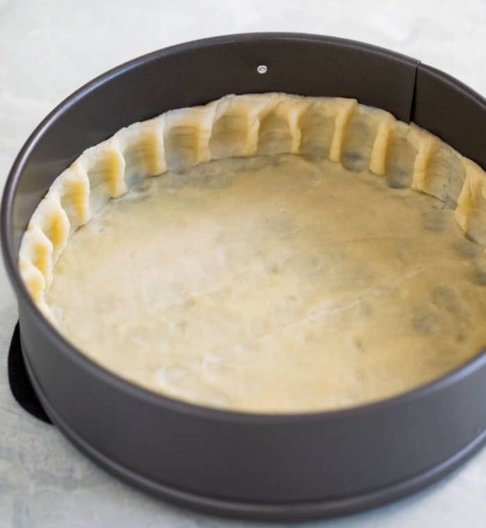 unbaked pie crust in a 9 inch springform pan