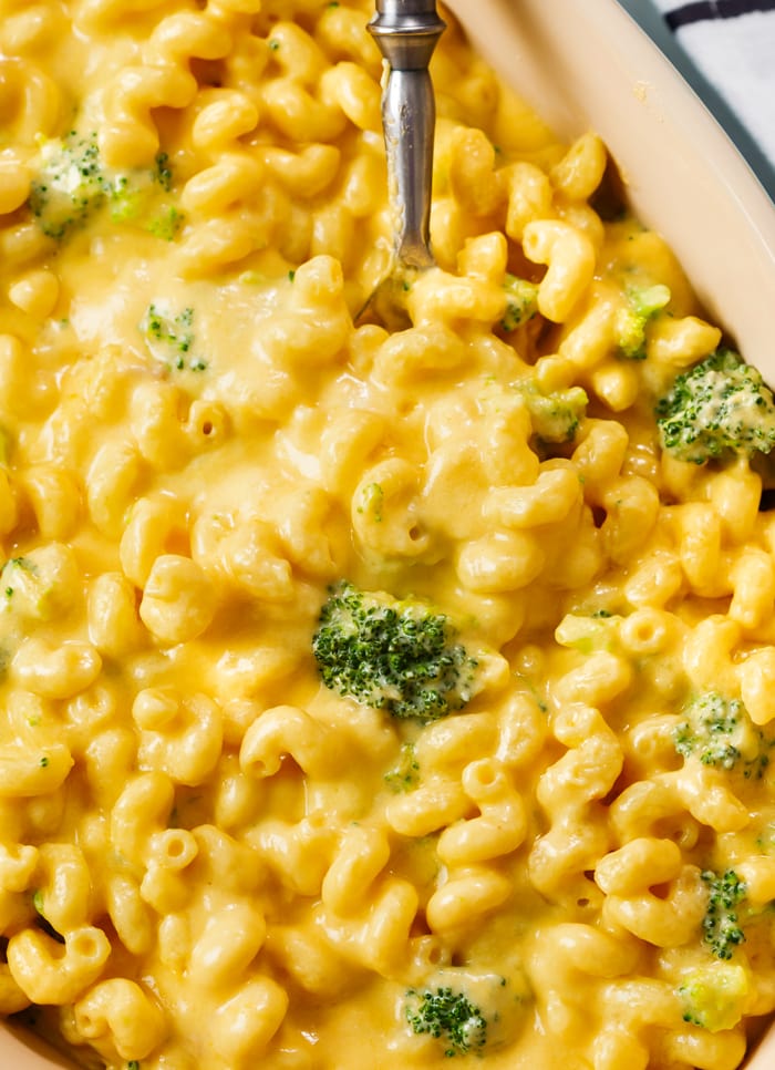 A casserole dish filled with Creamy Broccoli Mac and Cheese.
