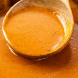 A labeled image of homemade enchilada sauce in a bowl.