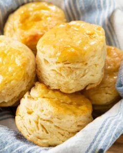 A bowl filled with fluffy Buttermilk Biscuits.