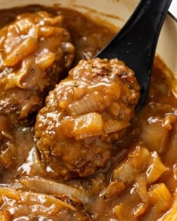 Hamburger Steak in brown gravy with onions.