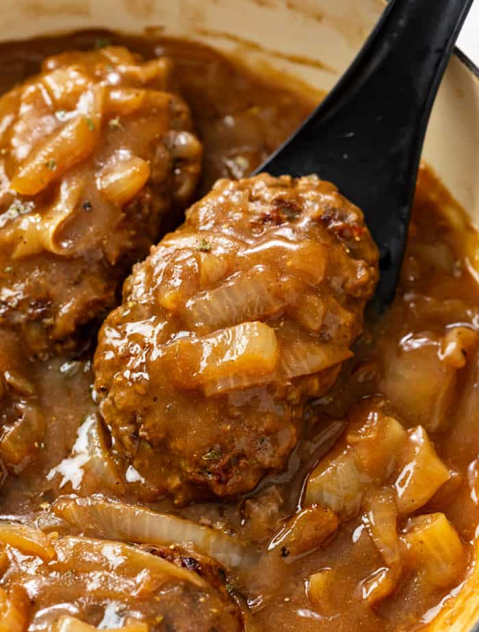 Hamburger Steak in brown gravy with onions.