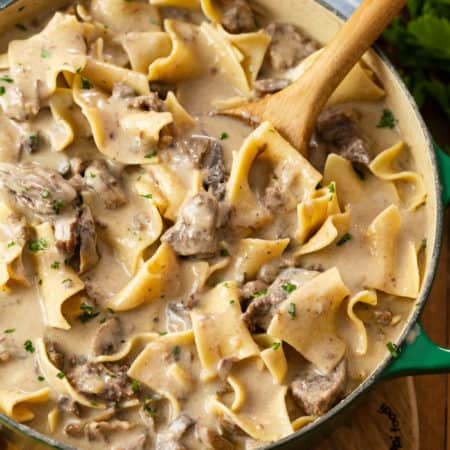 A dutch oven filled with hearty Beef Stroganoff made in the Slow Cooker.