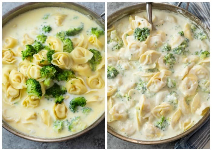 A skillet with Tortellini and broccoli being added to alfredo sauce.