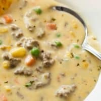 Shepherds Pie Soup in a white bowl with beef, vegetables, and a creamy potato broth.