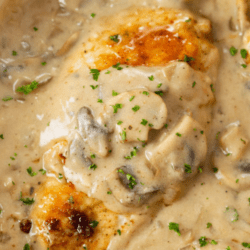 A labeled image of chicken stroganoff in a pan with creamy mushroom strognaoff sauce.