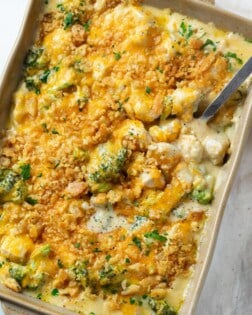 A casserole dish filled with creamy Chicken Divan with Broccoli topped with Ritz Crackers