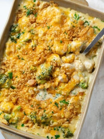 A casserole dish filled with creamy Chicken Divan with Broccoli topped with Ritz Crackers