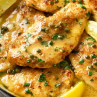 Chicken Piccata on with a lemon sauce topped with capers.