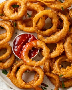 These homemade onion rings are deep fried in a flavorful batter and are so easy to make from scratch! Serve them with dipping sauce for fun appetizer idea.