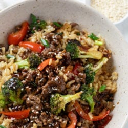 A labeled picture of Beef and Broccoli in a bowl with rice.
