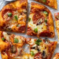 Naan bread pizza with Pepperoni, Mushrooms, and Peppers.