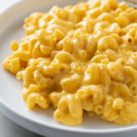 A plate topped with Creamy Mac and Cheese.