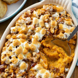 A collage of Sweet Potato Casserole in a casserole dish with a spoon.