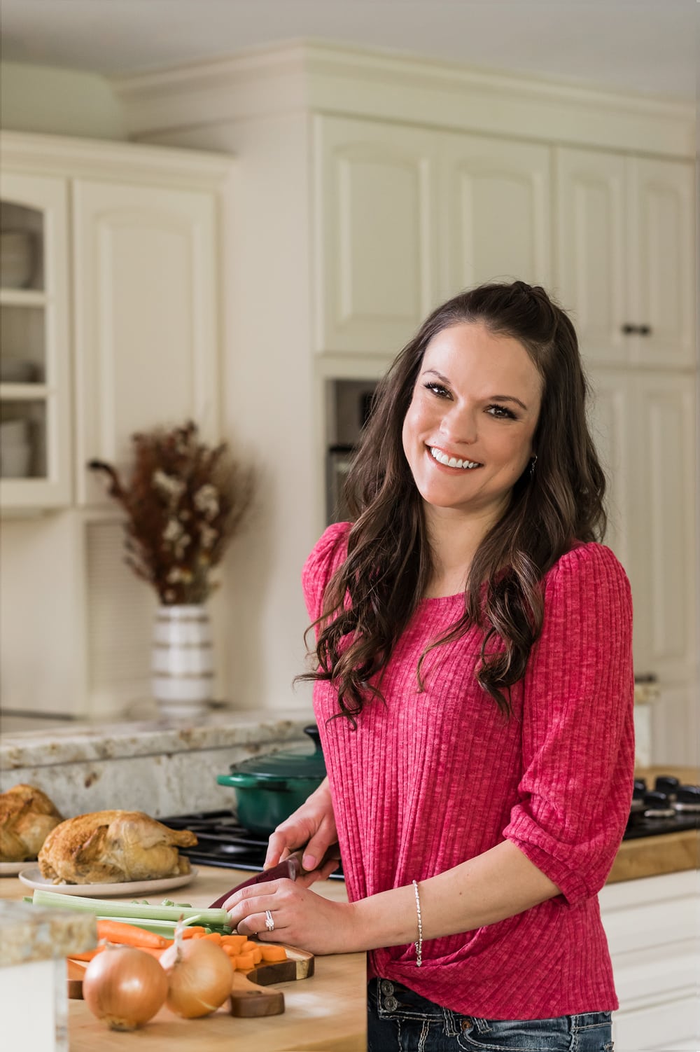 A picture of The Cozy Cook, Stephanie Melchione, cooking in her kitchen.