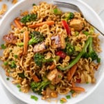 Ramen Noodle Stir Fry on a white plate with chicken and vegetables in sauce.