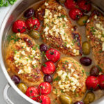 Greek Chicken in a Greek sauce topped with Feta, cherry tomatoes, and olives.