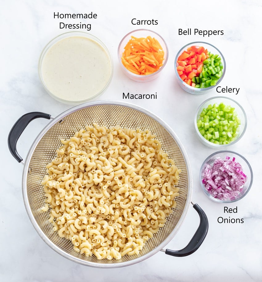 Ingredients-for-Macaroni-Salad on a white surface.