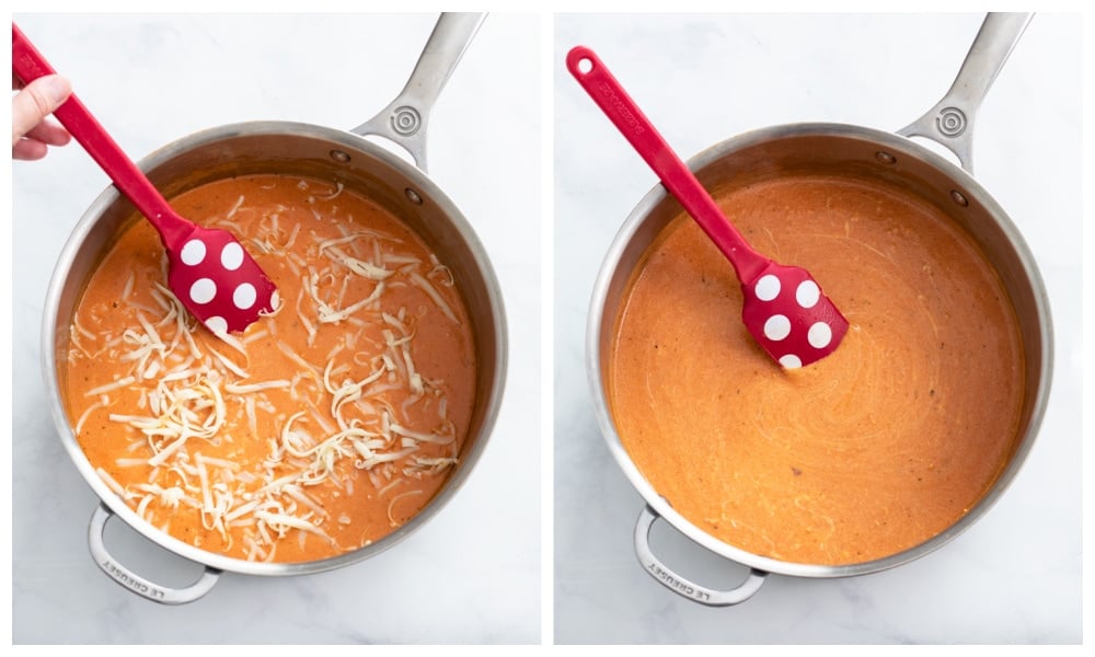 Adding cheese to a creamy pink sauce in a skillet.