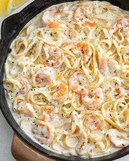 A skillet filled with Shrimp Alfredo with Fettucine.