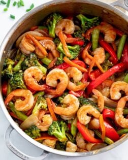 A skillet of Shrimp Stir Fry with vegetables.