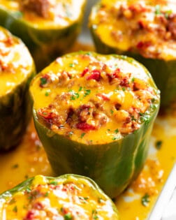 Stuffed Bell Peppers in a Casserole dish with meat and cheese.