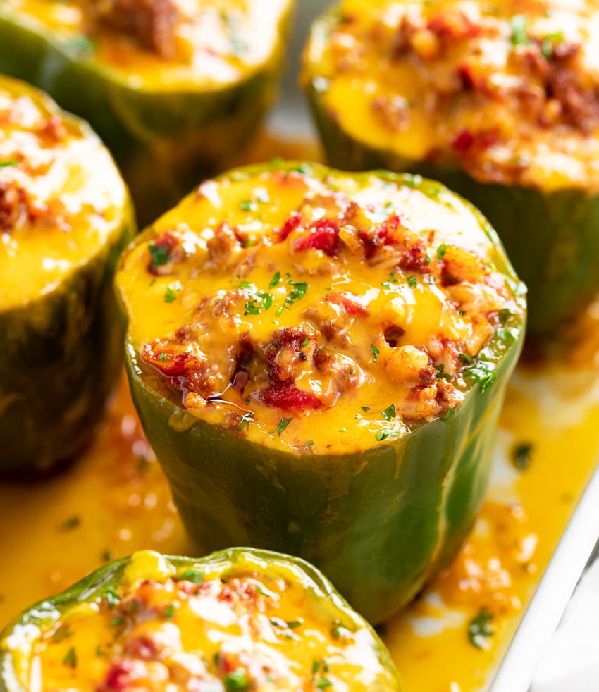 Stuffed Bell Peppers in a Casserole dish with meat and cheese.