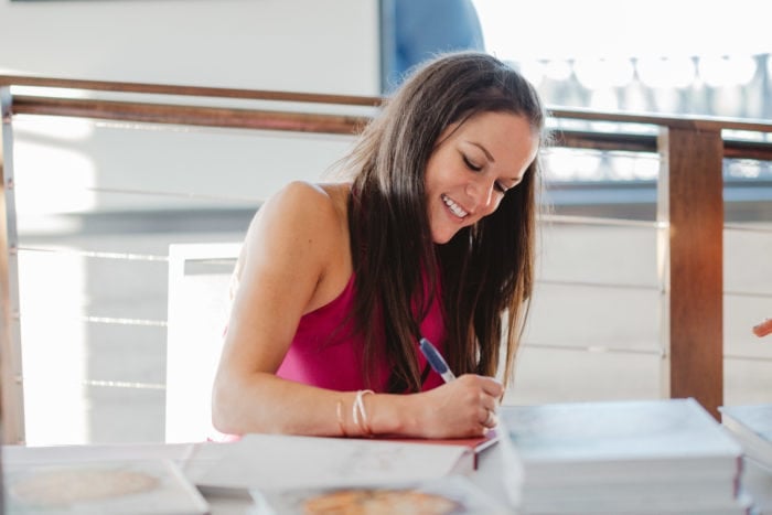 Stephanie Melchione signing copies of her book The Cozy Cookbook