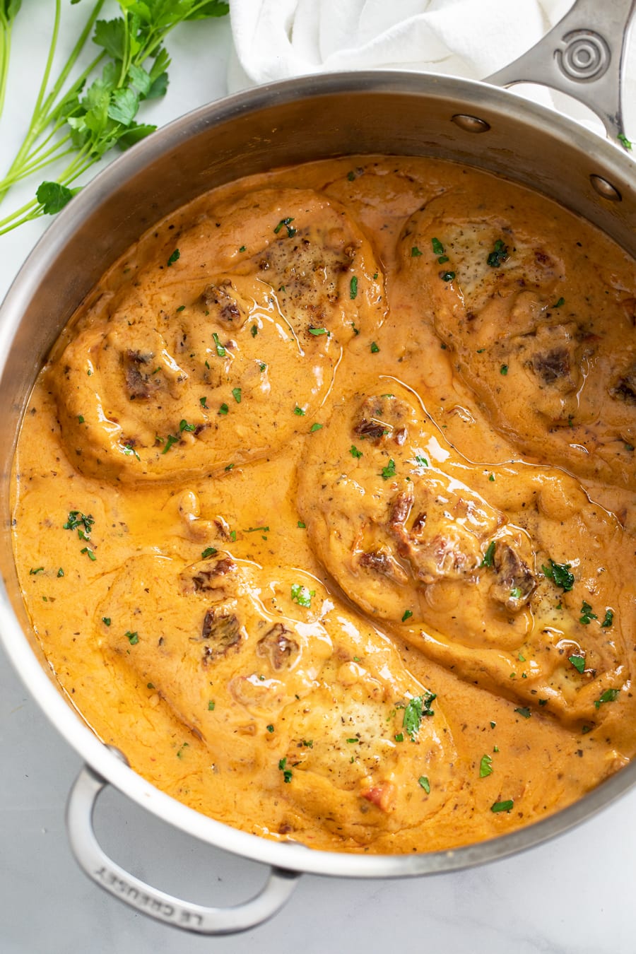 A skillet of Marry Me Chicken in a creamy sauce.