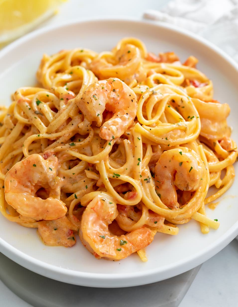 Creamy Shrimp Pasta on a white plate with linguine.