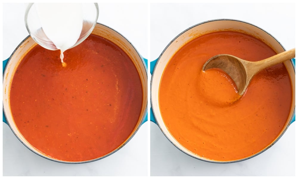 Adding cream to a pot of roasted red pepper soup.