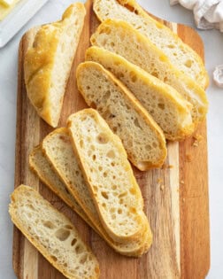 Slices of No Knead Bread on a cutting board.