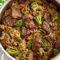A skillet filled with Beef and Broccoli Ramen in a brown sauce.