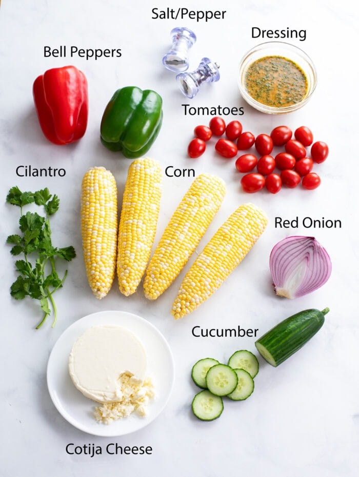 Labeled ingredients for making a Corn Salad with a white background.