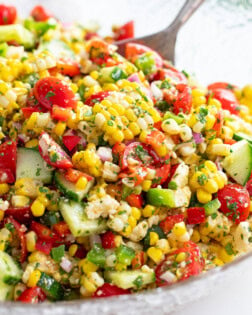 Corn Salad with a Mexican dressing tossed with vegetables and cilantro.