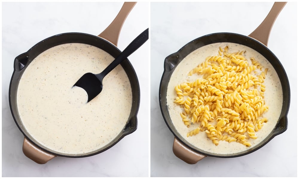 A skillet of white cheddar sauce next to a skillet with pasta being added to the sauce.