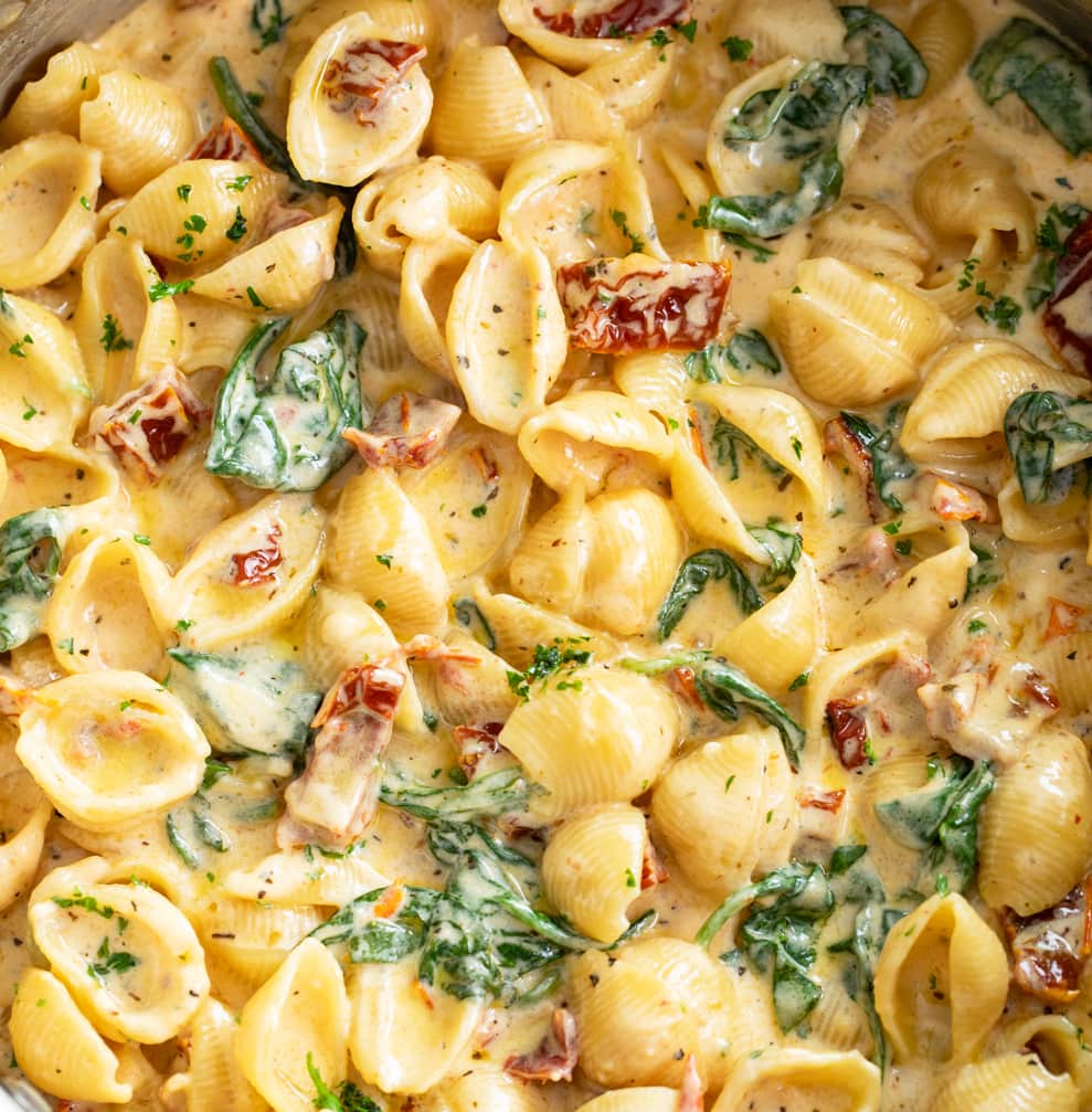 Pasta shells in a Creamy Tuscan Cheese Sauce with sundried tomatoes and spinach.