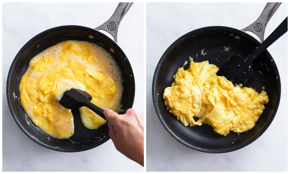 Using a silicone spatula to make fluffy scrambled eggs in a skillet.