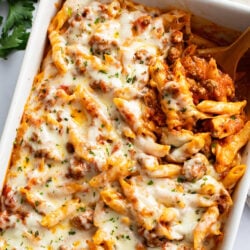 A labeled image of Ground Beef Casserole in a white baking dish with mozzarella cheese on top.