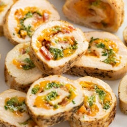 Slices of Chicken Roulade filled with Cheese, Broccoli, and Bacon.