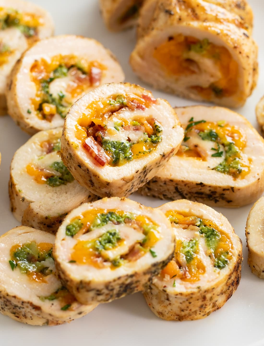 Slices of Chicken Roulade filled with Cheese, Broccoli, and Bacon.